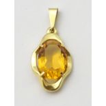 A 9ct gold pendant set with citrine coloured stone to centre.