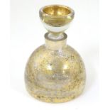 A 20thC squat formed scent bottle and stopper by LSA Poland, with burnished gold finish,