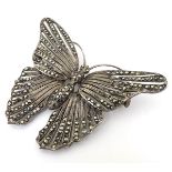 A white metal brooch formed as a butterfly set with a profusion of marcasites.