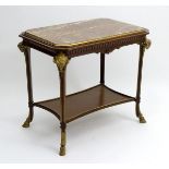 A 19thC marble top table with gilt brass surround,