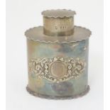 A silver canister with embossed decoration hallmarked London 1899 maker Josiah Williams & Co.