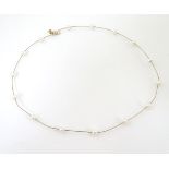 A 9ct gold necklace set with pearls, approx.