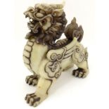 A carved Chinese cream coloured jade like winged luduan style creature with 4 toes 10" high x 10