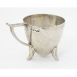 An Art Deco silver small mug with conical bowl,