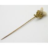 A Victorian Scottish stick pin surmounted by Scottish thistle set with deer's teeth.