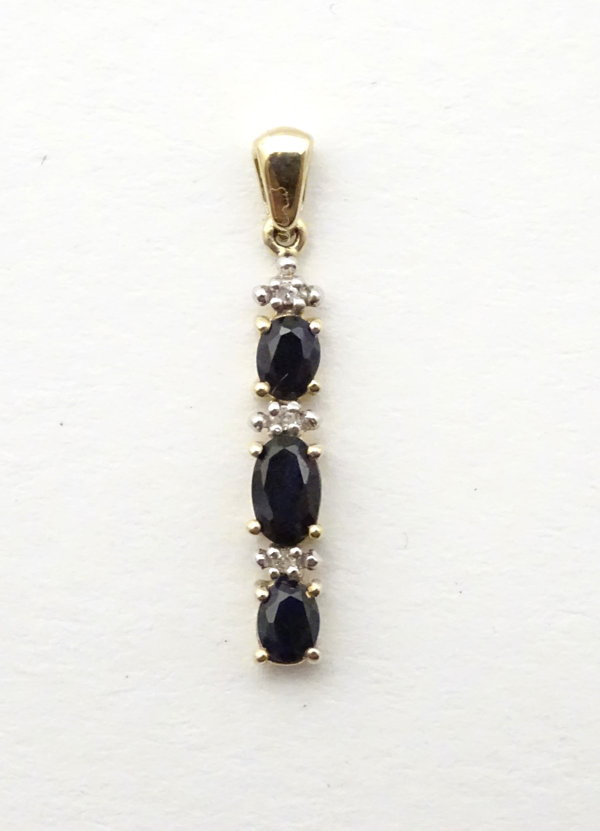 A 9ct gold pendant set with spinels and diamonds, 1” long. - Image 5 of 6