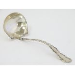 An American silver sauce ladle by Whiting manufacturing Co.