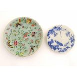 A Cantonese plate on a pale green ground decorated with birds, butterflies, flowers, and foliage,