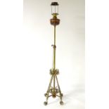 A 19thC brass telescopic standard lamp, formerly oil now converted to electricity,