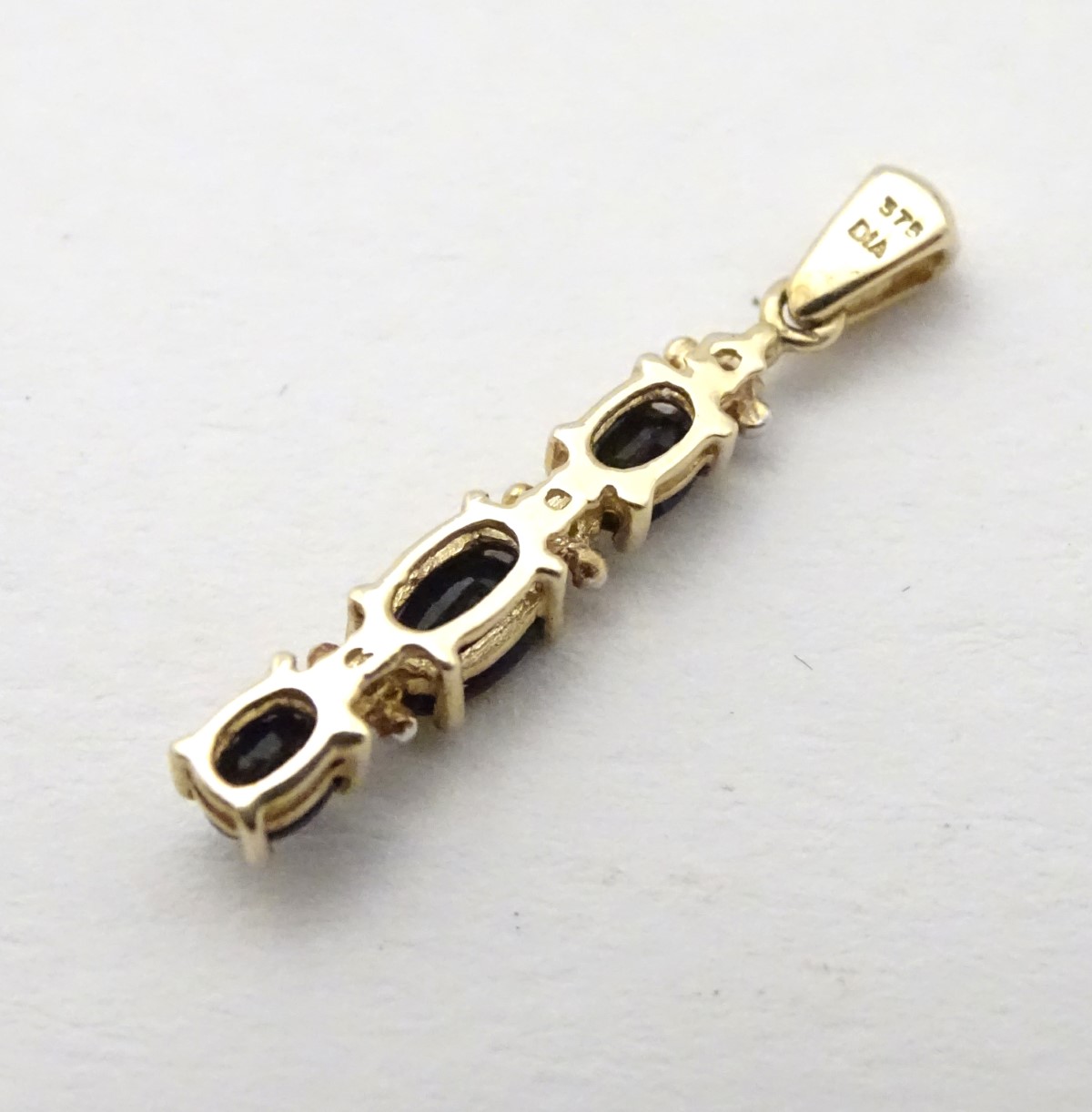 A 9ct gold pendant set with spinels and diamonds, 1” long. - Image 2 of 6