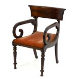An early 19thC mahogany open armchair with a large flame mahogany top rail above scrolled reeded