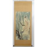 Chinese Scroll : a hand painted image of a woman in a garden , signed lower right,