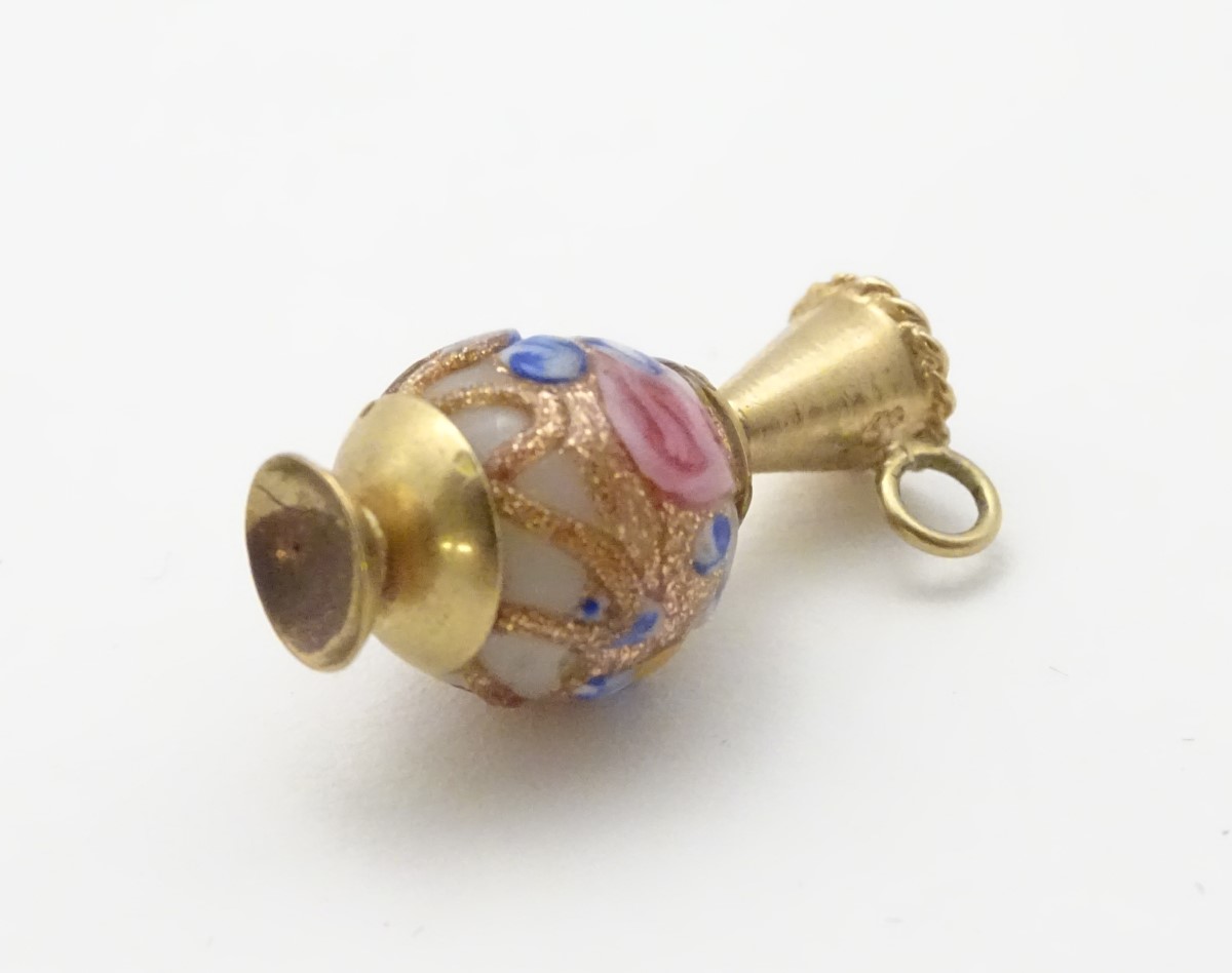 A 9ct gold charm formed as a ewer with a Venetian bead formed body. - Image 7 of 7