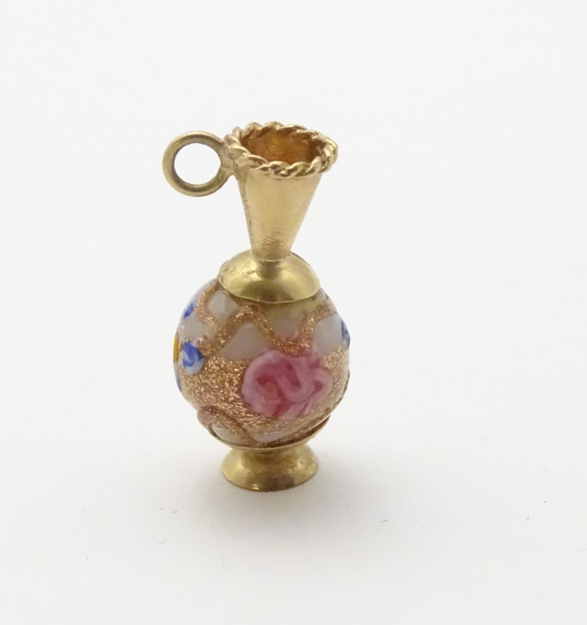 A 9ct gold charm formed as a ewer with a Venetian bead formed body.