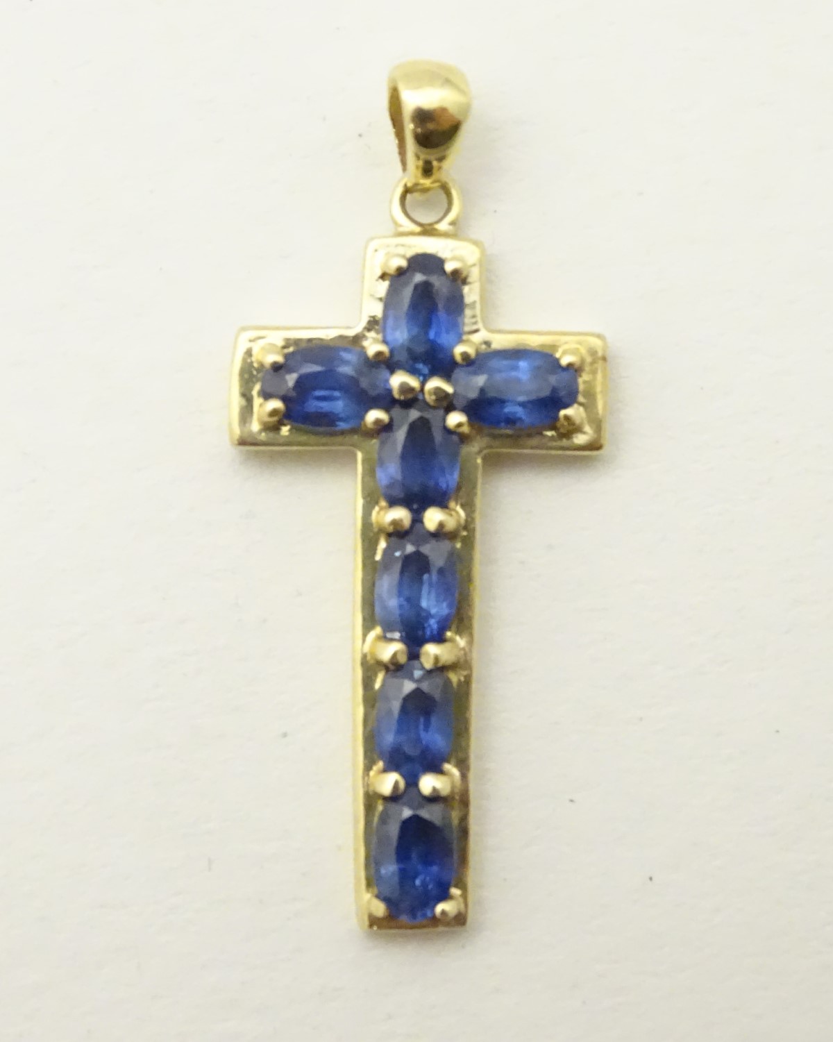 A 9ct gold cross formed pendant set with 7 topaz. - Image 4 of 4