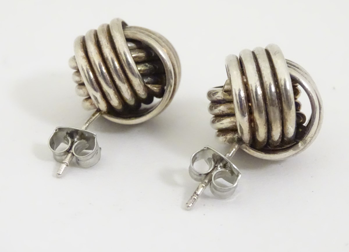 A pair of white metal stud earrings formed as large knots. - Image 4 of 4