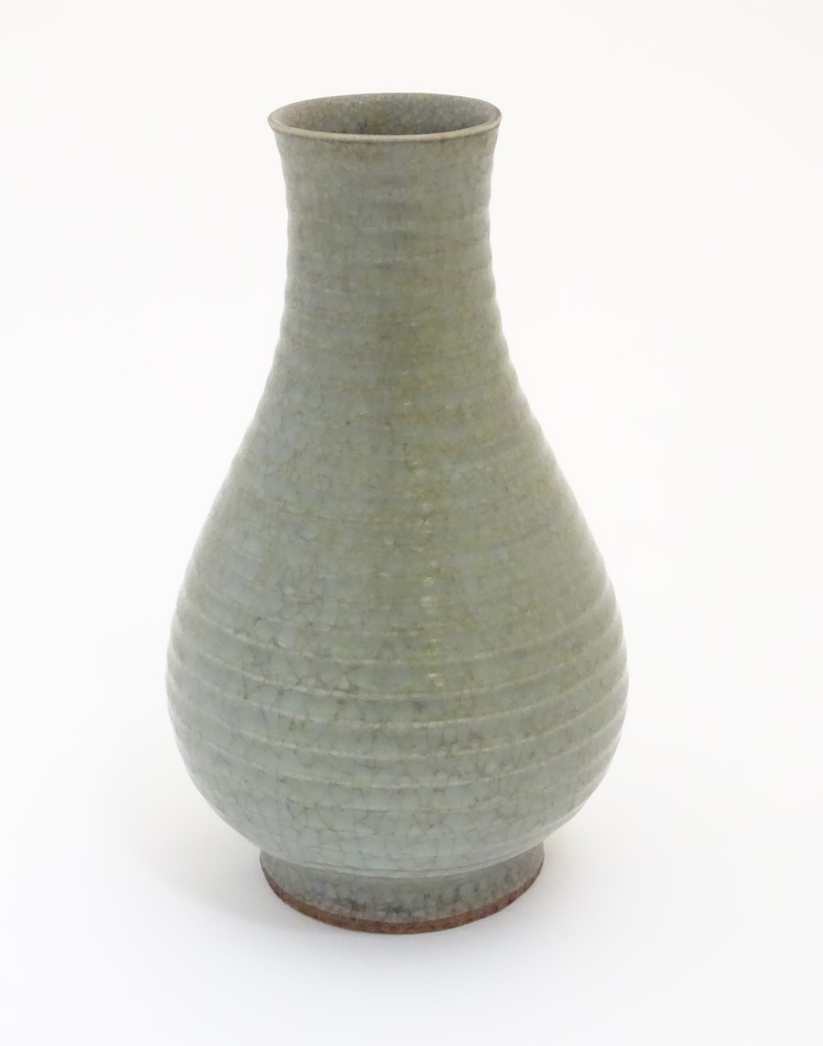 A Chinese celadon pear-shaped vase with a crackle glaze. Approx. 9 3/4" high.