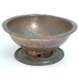 An Arts and Crafts style footed copper bowl with hammered and pierced decoration. Approx.