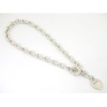 Silver chain choker / necklace with heart shaped pendant. Marked 'Tiffany & Co'.
