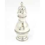 A silver sugar shaker / caster / muffineer hallmarked London 1908 maker Wakely & Wheeler.