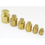 A set of six early-20thC brass 'chess' scale weights, 10 Troy oz to 1 Troy oz,