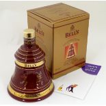 A boxed Wade porcelain decanter of Bell's 'extra special' old scotch whisky, Christmas 1999 edition,