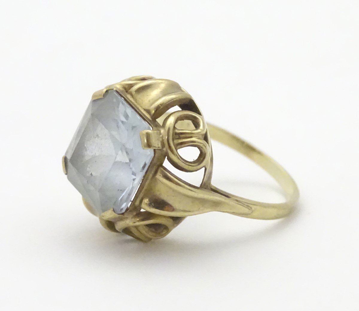 An 8ct (333) gold ring set with large white stone to top.