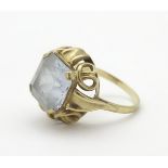 An 8ct (333) gold ring set with large white stone to top.