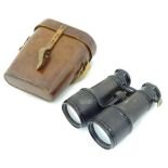 A pair of early-20thC cased binoculars, having adjustable focus marked 'Field Marine Theatre',