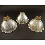 Three holophane style glass light shades, each with tapering fluted decoration,