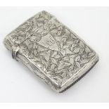 A silver vesta case with engraved decoration hallmarked Birmingham 1900 maker Mitchell Bosley & Co.