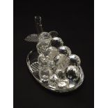 A Swarovski-style crystal table decoration in the form of a bunch of grapes, with mirrored base,