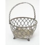 A silver basket / sucrier frame with singe over handle.