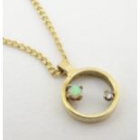 A 9ct gold pendant and chain, the pendant set with diamond and opal.