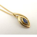 A 9ct gold necklace and pendant, the pendant set with sapphire.