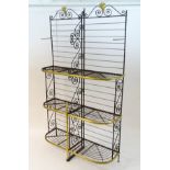 An early 20thC patisserie / bakers display stand of wrought iron and brass construction,