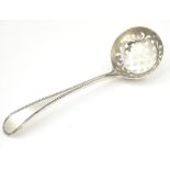 A silver sifting spoon with bead handle 7" long CONDITION: Please Note - we do not