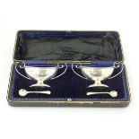 A cased pair of silver salts hallmarked Birmingham 1909 maker J Sherwood & Sons.