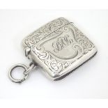 A silver vesta case with engraved decoration. Hallmarked Birmingham 1905 maker Reynolds & Westwood.