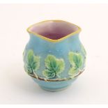 A George Jones majolica pot with banded vine leaf decoration and a lozenge shaped rim. Approx.