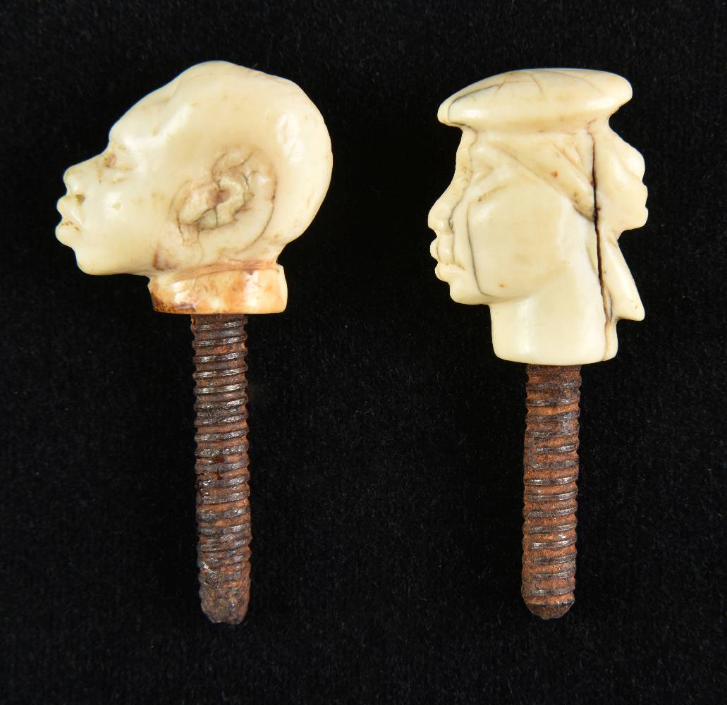 *Finials. A pair of 19th century African ivory finials, probably cane tops, carved as a male and - Image 2 of 2