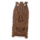 *New Guinea. A carved hardwood splashboard, intricately carved with ceremonial figure amongst