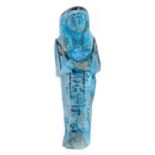 *Ancient Egypt. 21st Dynasty, pale blue faience Shabti probably Ta-di-Mut, the mummiform figure