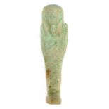 *Ancient Egypt. Ptolemaic, pale green faience Shabti, the mummiform figure modelled with