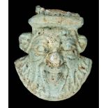 *Ancient Egypt. Bes head amulet, modelled as the god Bes, with characterful face, 4cm high (1)