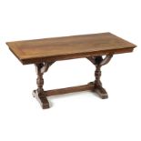 *Library Table. Victorian mahogany Gothic revival library table, the rectangular top above curved