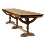 *Table. A large Victorian Gothic revival mahogany refectory table, the rectangular top above three