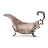 *Sauce Boat. A silver sauce boat by Henry Wilkinson, Sheffield 1924, plain with flying scroll handle