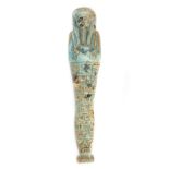 *Ancient Egypt. Ptolemaic, blue green faience Shabti of Ta-Amun, the mummiform figure modelled