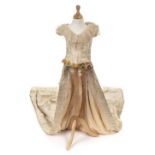 *Dress. A damask bridal bodice and train, circa 1880s, comprising cream boned bodice, with cap